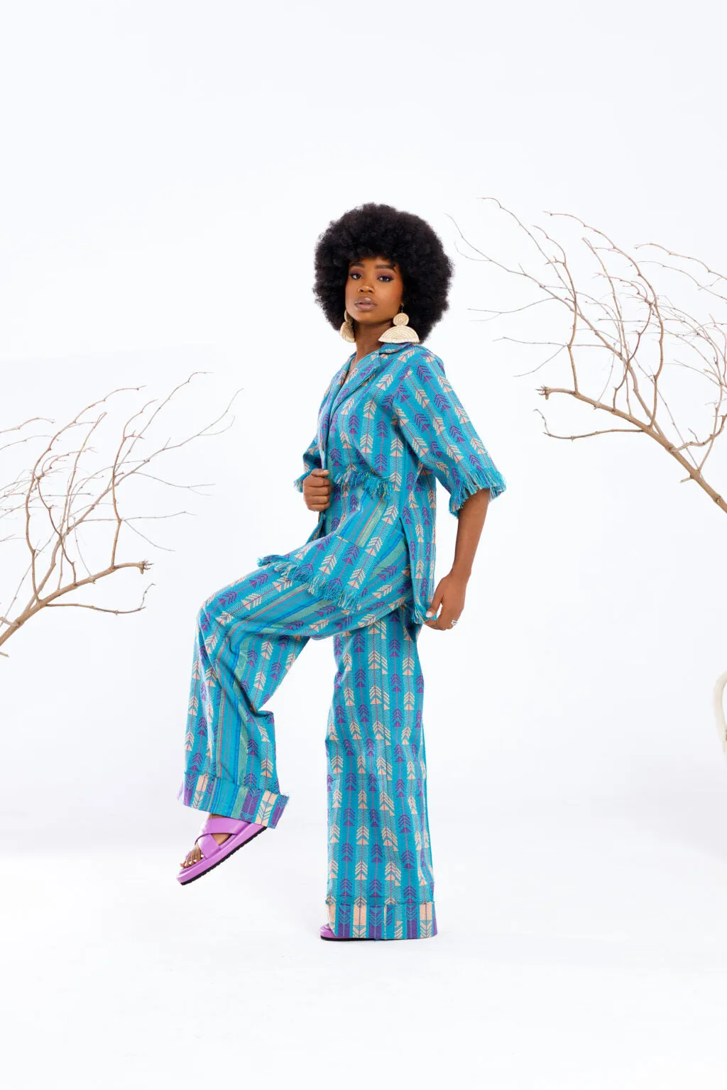 Atuche Osisi wooden set with an oversized shirt and trousers